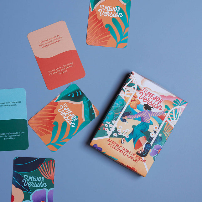 Caja de kit Amuratta con 30 tarjetas ilustradas de retos y frases inspiradoras.