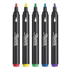 Cinco marcadores Sharpie acrílicos punta pincel en colores surtidos (rojo, amarillo, verde, azul, morado) alineados sobre fondo blanco.