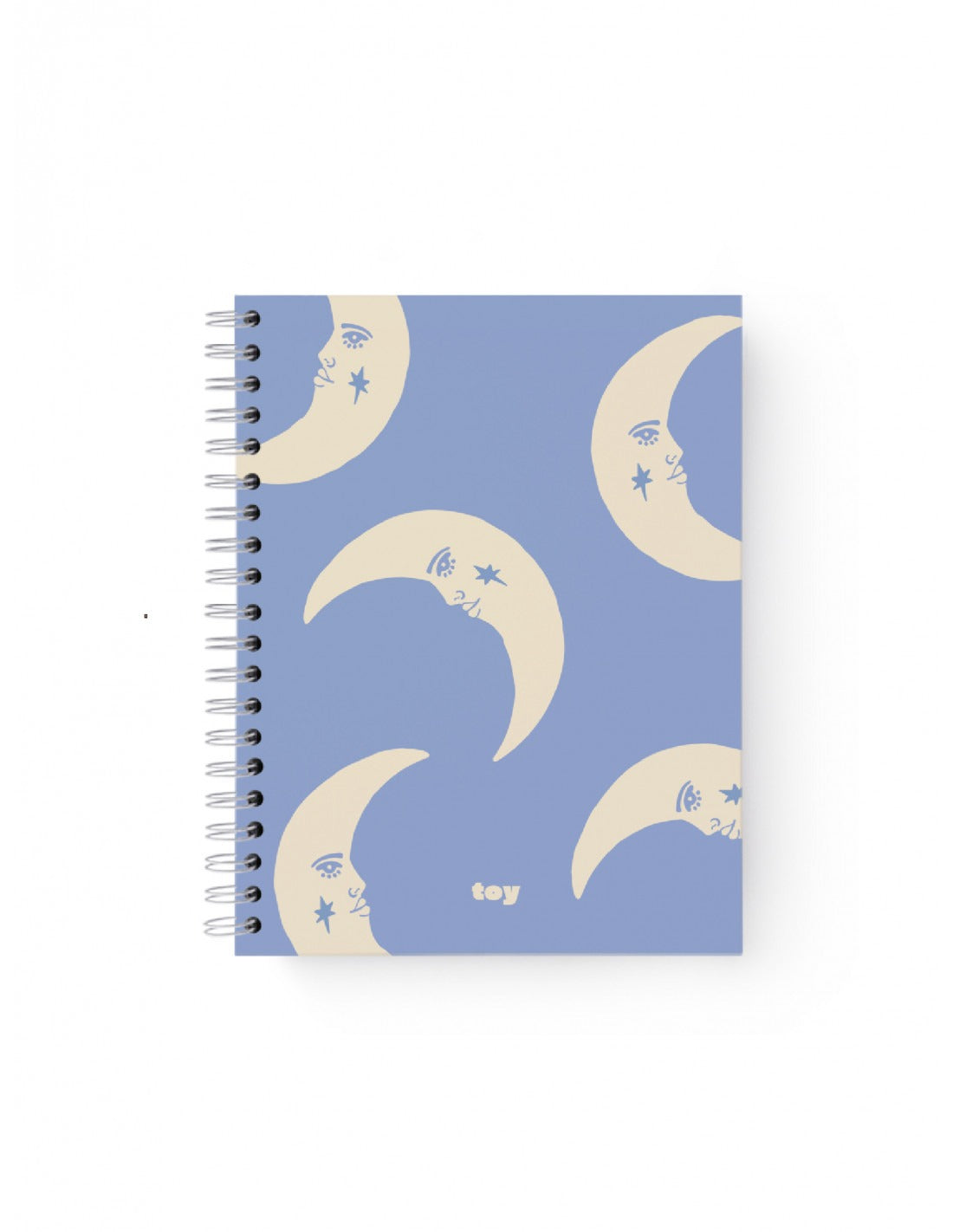 Cuaderno grande Toy con portada lila y diseño de lunas blancas, encuadernado con argollado metálico.