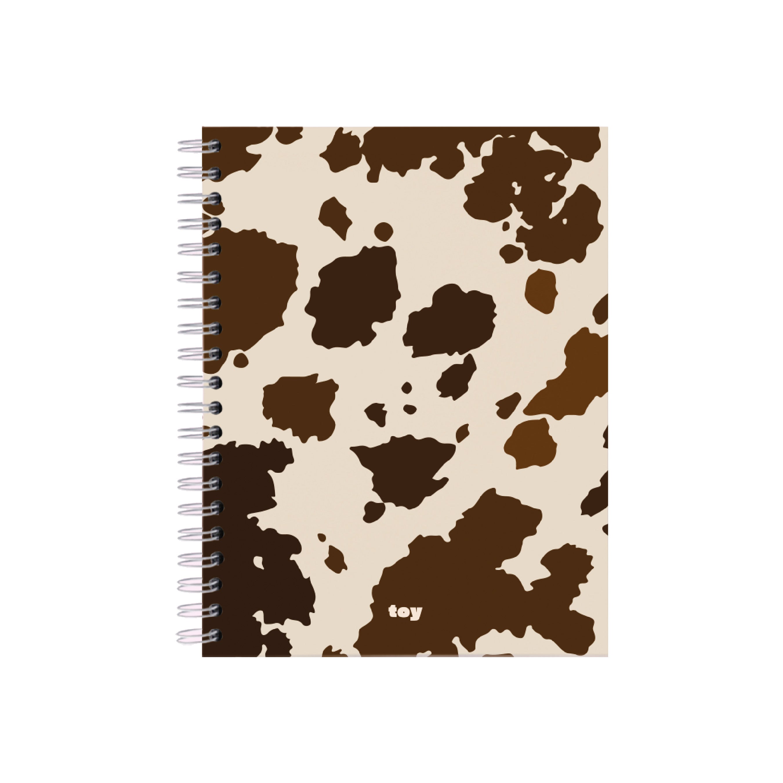 Cuaderno argollado Cow Print Toy de 5 materias con cubierta blanca y manchas negras tipo vaca, 150 hojas bond, argolla blanca visible y estilo juvenil.