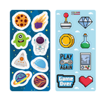 Stickers removibles Imántica con diseños espaciales: astronauta, cohete, planeta, alien y meteorito.
Y gamer retro: joystick, diamante, poción, consola, corazón pixelado y frases “Play Again” y “Game Over”.